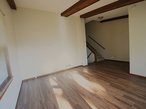 18' x 14' Living room looking towards stairs that go up to bedrooms or down to kitchen