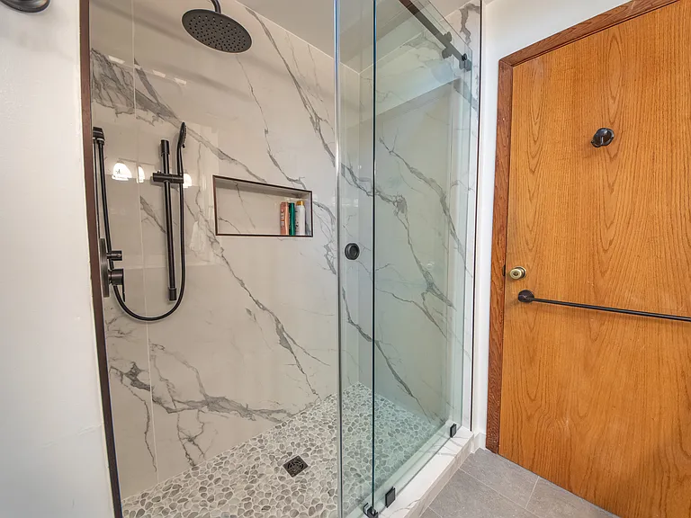 Brazilian Porcelanato shower with rain fall shower head.