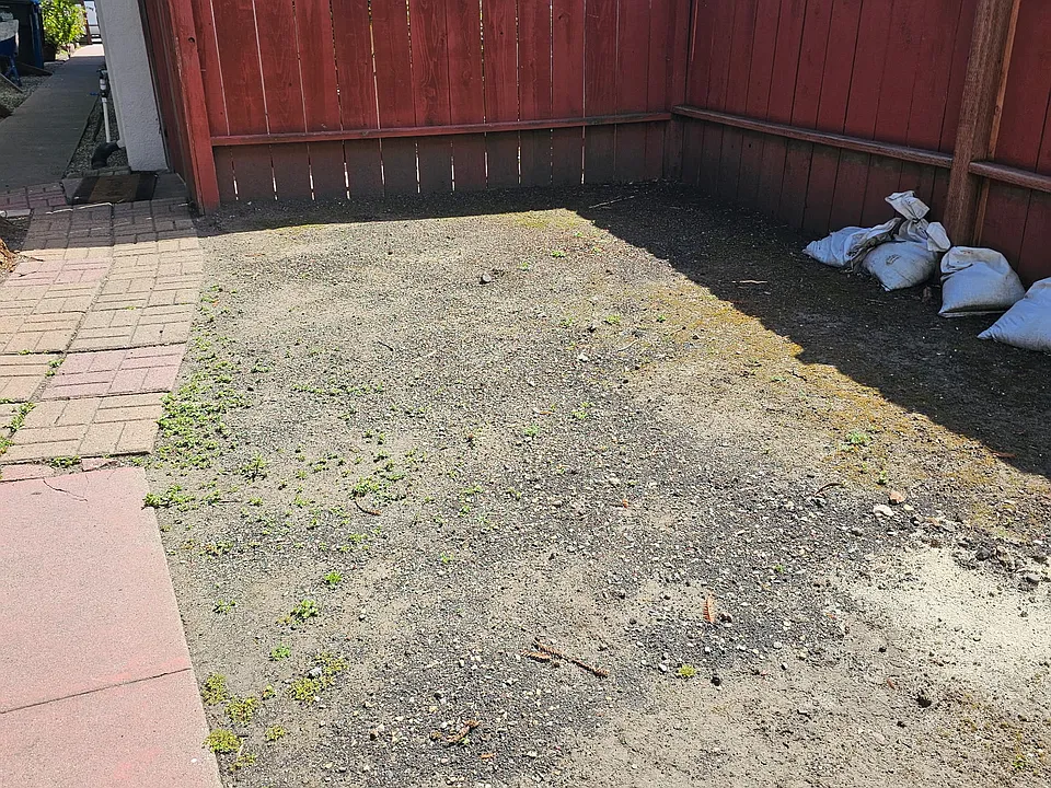area to the left as you walk thru the side yard to the front door