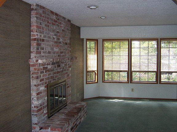 living room w/bay windows and fireplace