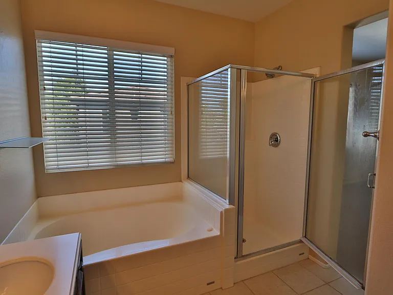 Master bath has separate soaking tub and shower