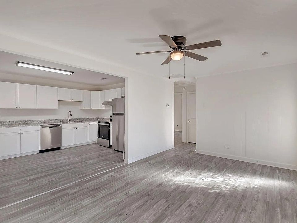 Living Room Flows Seamlessly into Completely Renovated Kitchen (Shown Here Before New Microwave & Refrigerator)