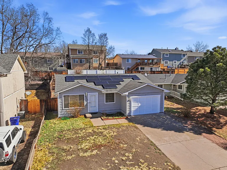 Front of house, with 13 solar panels.