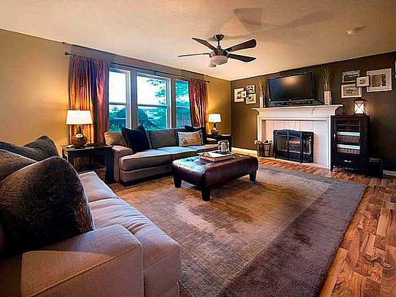 Family Room. Sunfilled family room overlooks the backyard and offers a fireplace with gas starter, allowing you to easily add gas logs.