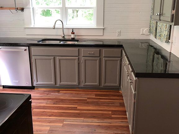 Renovated kitchen with cool concrete countertops