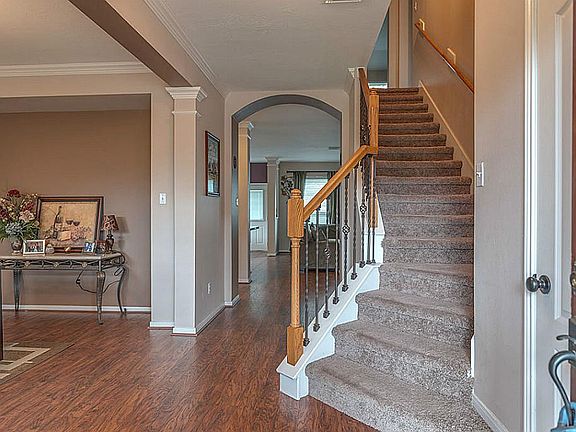 Upgraded wrought iron banister showcases stairs