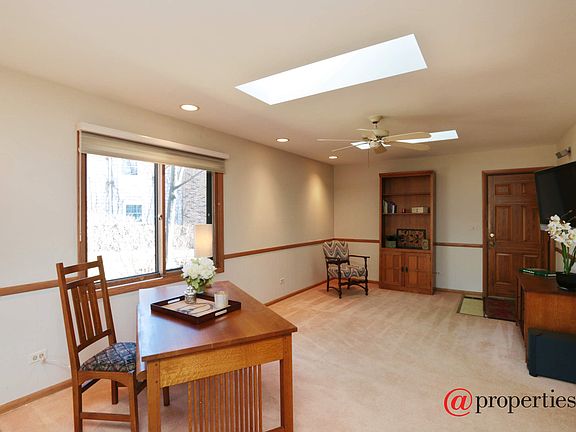 Family Room, Crisp and neutral with sunny skylight