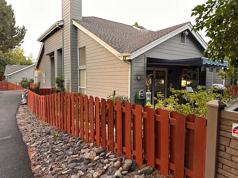 Back deck and awning in a peaceful backyard.
