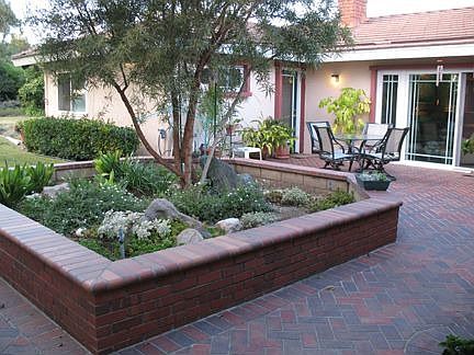 Beautifully hardscaped courtyard greets you