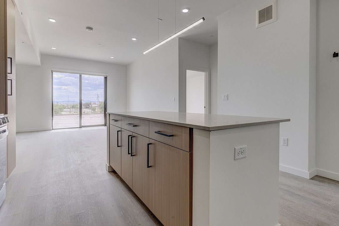Open-concept living with a spacious kitchen island and contemporary finishes.