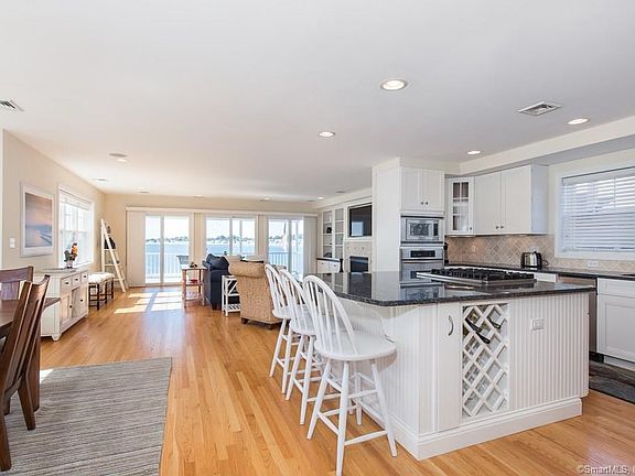 Open floor plan with glistening water views