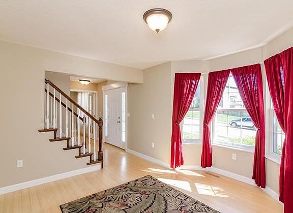 Living Room w/Bamboo Flooring & Bow Window