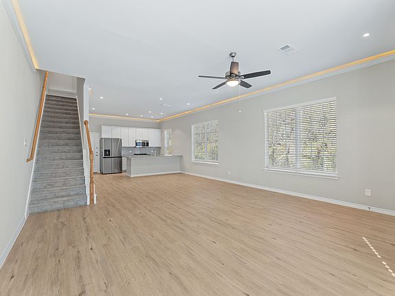 Open Space Living Room with Crown Molding - New Home