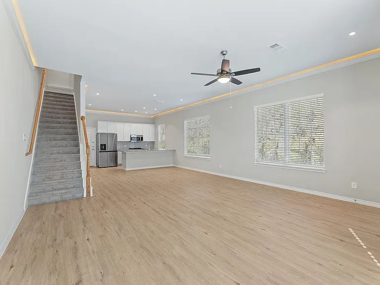 Open Space Living Room with Crown Molding - New Home