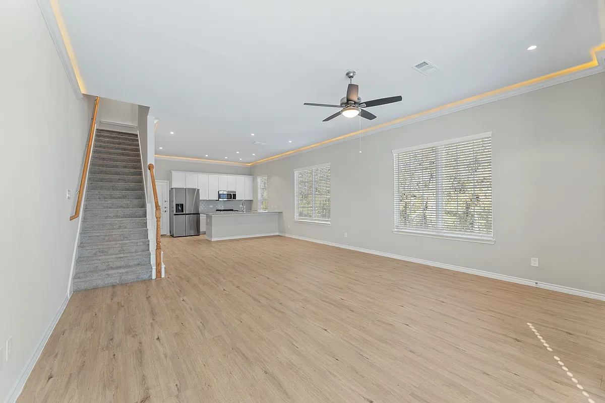 Open Space Living Room with Crown Molding - New Home - Audra Townhomes