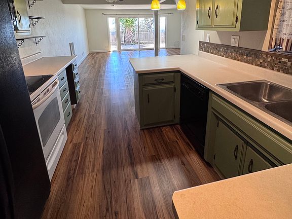 Kitchen and living space as you walk in from the garage.