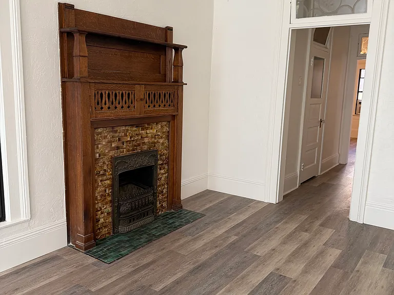 The very cozy wood burning fireplace is original to the house.