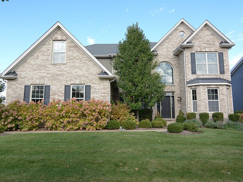 Elegant and Stunning Brick and Cedar Custom Birch II Model with 3 Car Garage