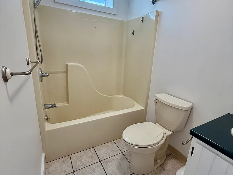 Full size shower/bathtub unit.