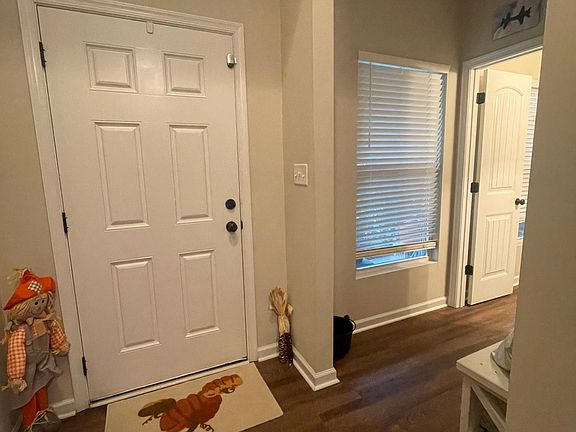 Front entry way with half bath to the right