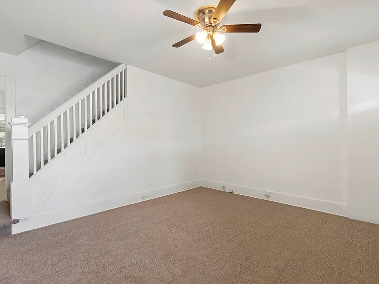 Living room with stairs leading to the 2nd floor.