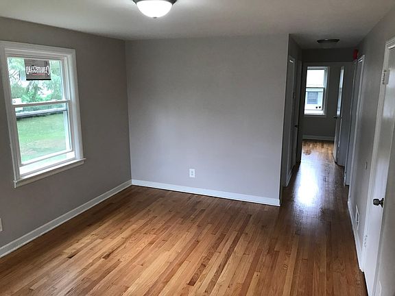 Beutiful living room with hallwway access to three bedrooms and bathroom