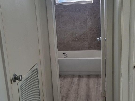 Hallway area showing a/c closet and bathroom