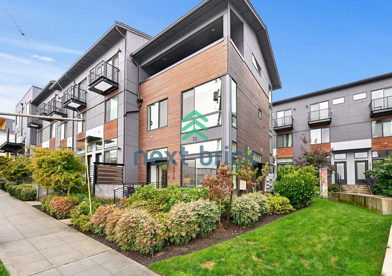 "Modern 3-Bedroom End-Unit Townhome with Spacious Deck, Quartz Kitchen & Convenient Transit Access" — Photo 1