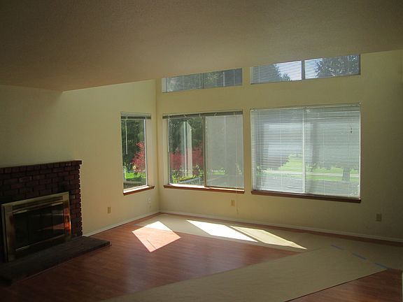 Living room with fireplace & Large view windows