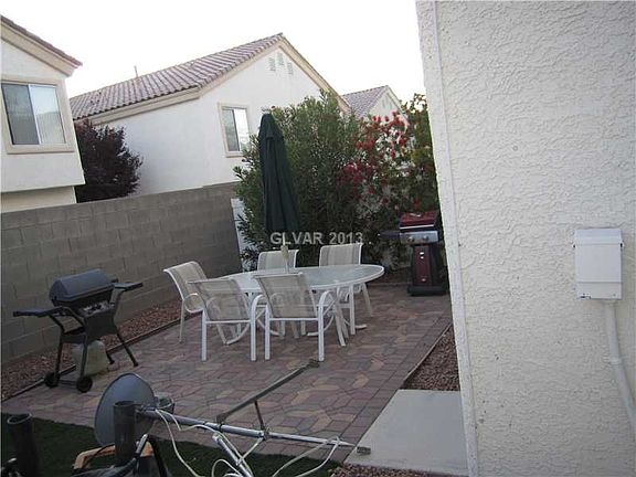 Fenced Backyard with grass and patio space