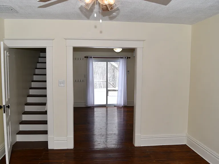 Living room looking into dining room and stairway.