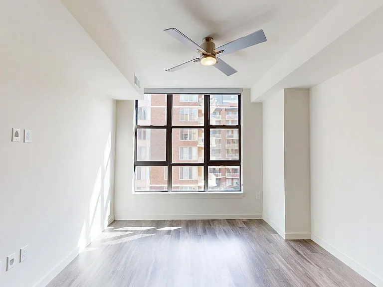 Apartment living room with wood-style flooring.