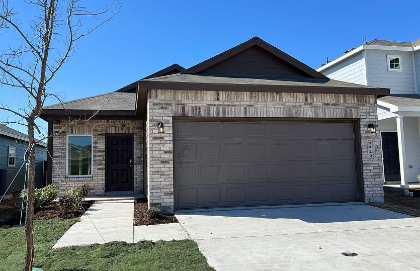 The Livingston, a one-story home with 2-car garage, home exterior LS103 exterior features may vary