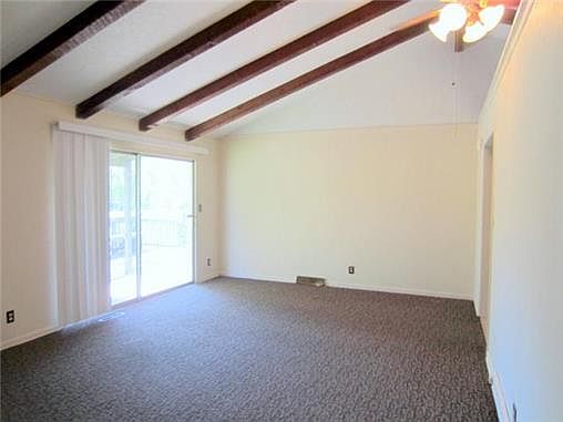 Great Room with Vaulted Ceiling and Sliding Doors