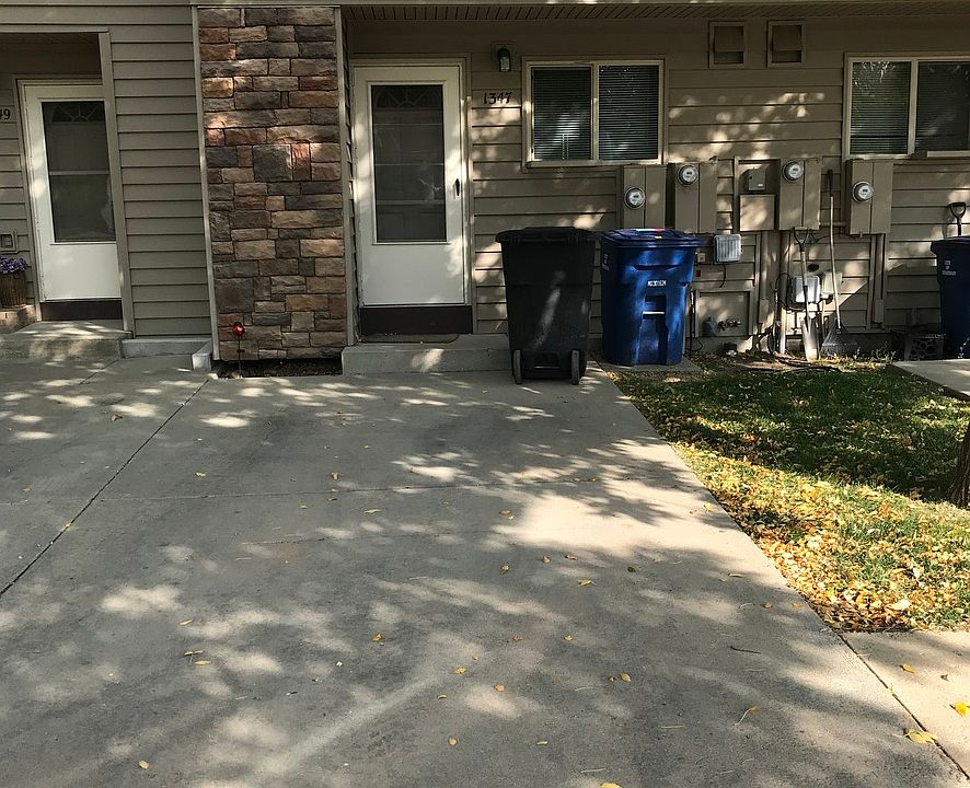Front with off street parking and mature landscaping.