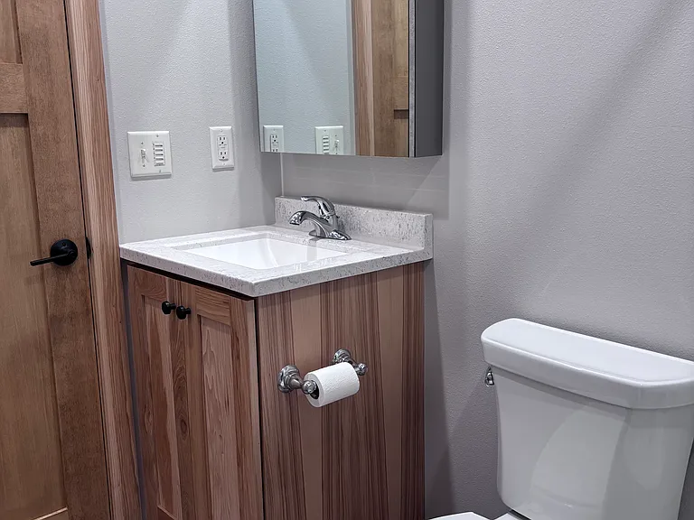 Medicine cabinet mirror above vanity