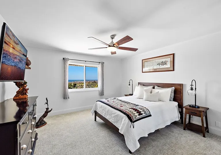 Wake up to coastal views in this spacious bedroom.