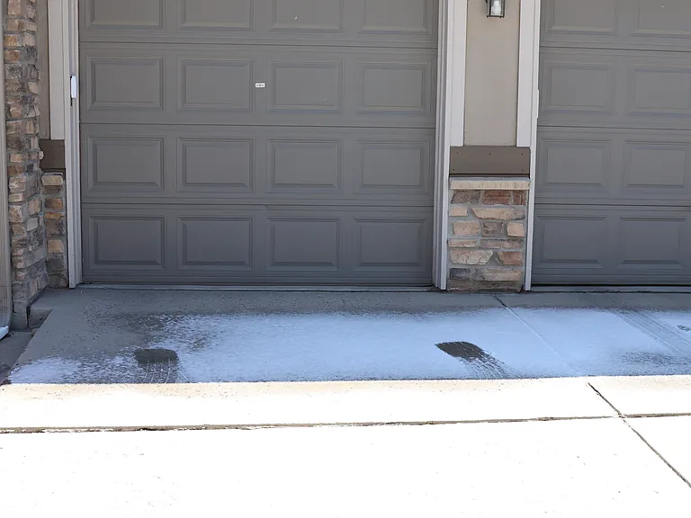 Single car garage with shelving and remote