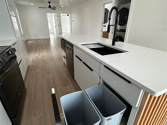 Kitchen island with trash / recycle