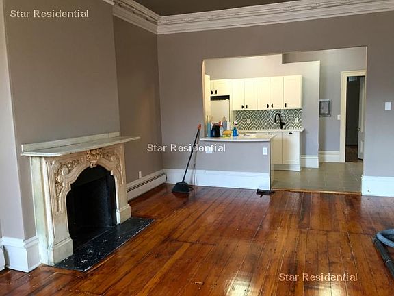 Living room showing the kitchen