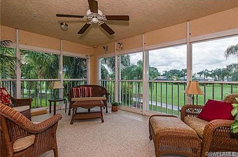 Acrylic enclosed lanai for year round living. 2 glass sliders fr