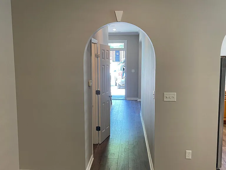 VIEW OF FRONT HALL AND ENTRY FROM DEN.