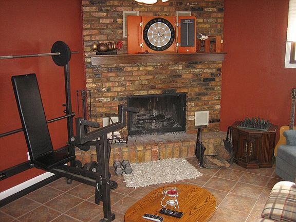 Downstairs rec room with fireplace