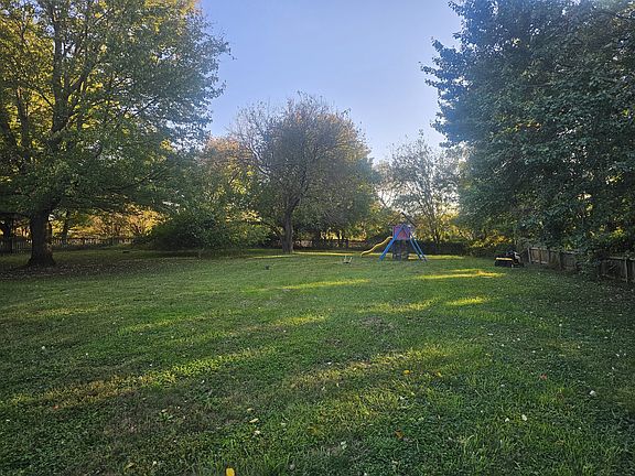 Large/flat fenced back yard for your human and/or furry children