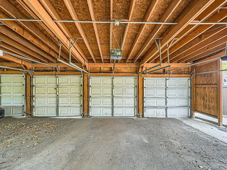 Secure Carport leads to the back entrance of the townhome