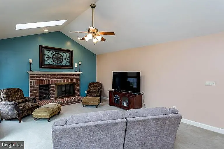 Family Room - the room has been freshly painted and the carpet has been replaced. Fireplace has been washed and painted with new gas set and inlay. TV Mount above fireplace. Also has electronic doggie door to the deck.