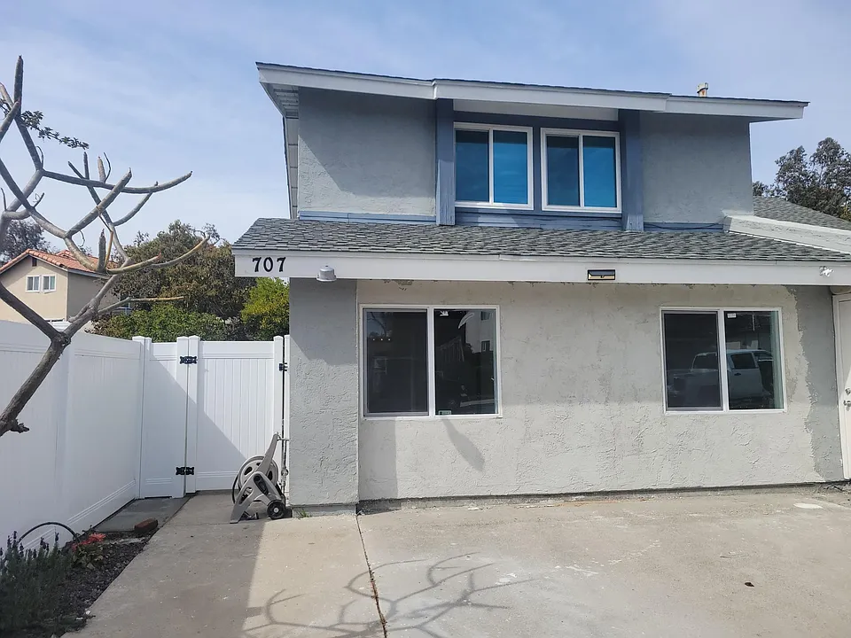 Entry to the unit on the side of the house
