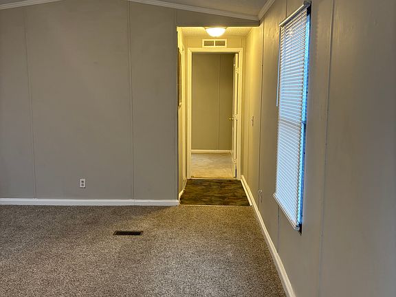 Living room to hallway to second bedroom and bathroom