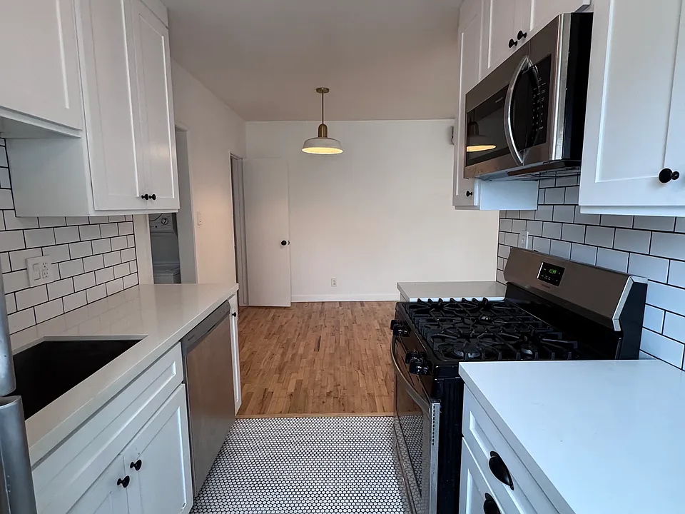 Includes dishwasher, microwave, fridge, oven, and subway tile backsplash.