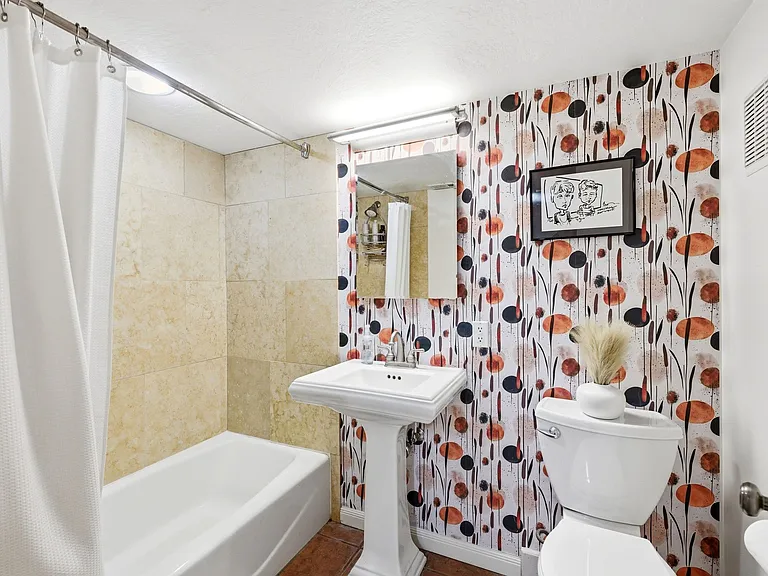 Full bathroom with tub on the lower level.
